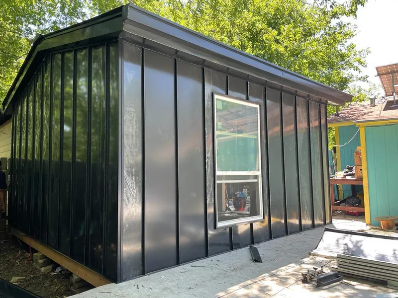 Black standing seam metal wall panels for Roof Inspection in Valley Falls